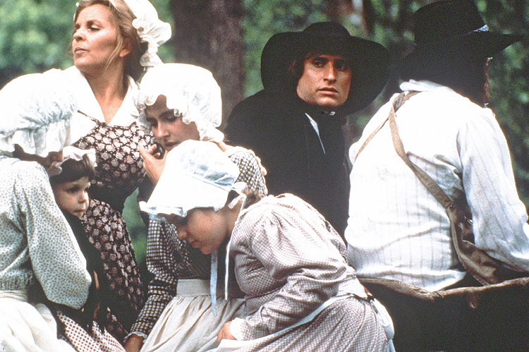 Travelling to the new world, last leg of the journey by wagon in the wilds of Western Pennsylvania.  Jane Campbell (Susan Seaforth Hayes) huddles her younger brood (Katie Cook, Kermit Cook, Katie Hull, Nicole Du Bois, Jennifer Fuqua, Doris Cochran) while Alexander (Paul Mercier) worries about what lies ahead. The wangon driver is Junior Murrell one of our amazing wranglers who supplied all our period vehicles and tack.   From the award-winning drama, WRESTLING WITH GOD.