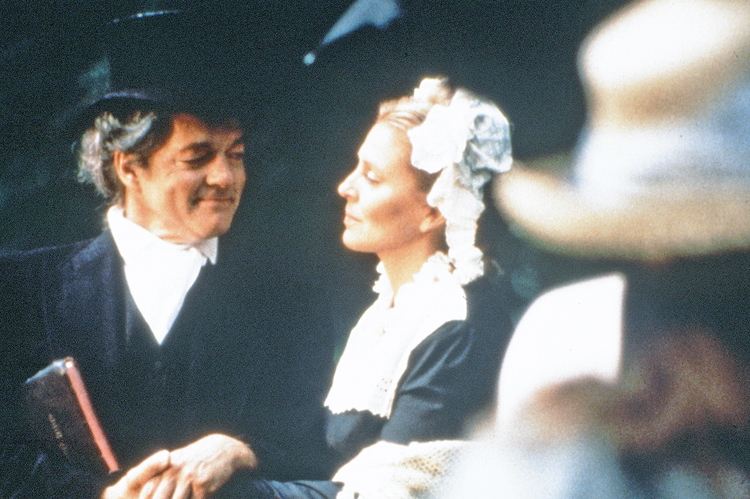 Thomas Campbell (Bill Hayes) and Jane (Susan Seaforth Hayes) share a moment at the baptism scene, under the watchful eye of our meticulous Costume Designer, Debra DeVito Jackson (in the straw hat, foreground).   From the award-winning drama, WRESTLING WITH GOD.