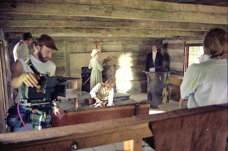 Shooting the Campbells setting up their first church - in a restored log church near Gaston's Mill in Ohio. L>R Michael Strong (production recordist), Kevin Cable (DP), Susan Seaforth Hayes (Jane Campbell), Paul Mercier (Alexander Campbell), Bill Hayes (Thomas Campbell), Jerry L. Jackson (writer/director/producer). Hidden on the other side of Jerry is Allison Gregory (Margaret Campbell). From the award-winning drama, WRESTLING WITH GOD.